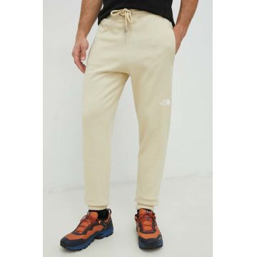 The North Face pantaloni de trening din bumbac barbati, culoarea bej, neted