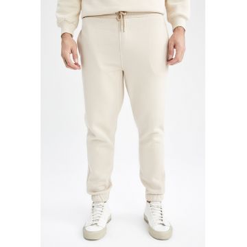 Pantaloni sport cu snur si buzunare laterale