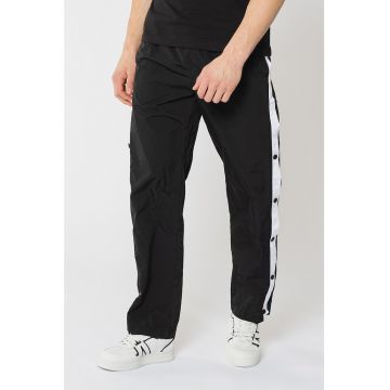 Pantaloni sport cu slituri laterale cu capse