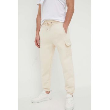 Alpha Industries pantaloni de trening culoarea bej, neted