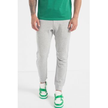 Pantaloni sport conici cu buzunare cu fermoar