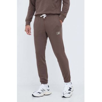 New Balance pantaloni de trening culoarea maro, neted