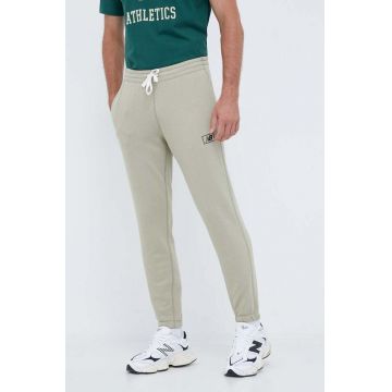 New Balance pantaloni de trening culoarea verde, neted