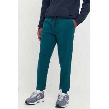 Rip Curl pantaloni de trening barbati, culoarea verde, neted