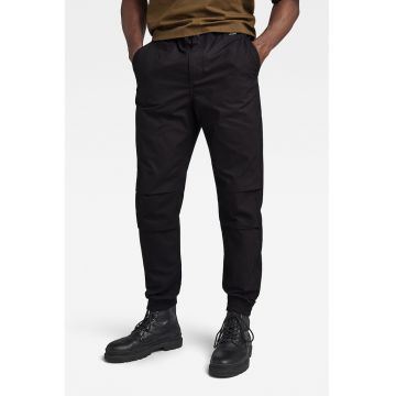 Pantaloni conici cu buzunare oblice