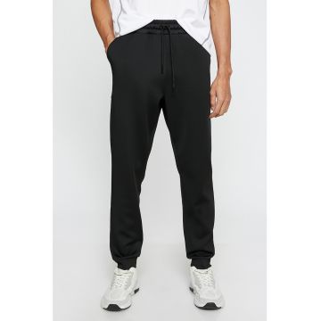 Pantaloni sport cu buzunare laterale