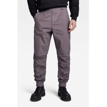 Pantaloni conici cu buzunare oblice