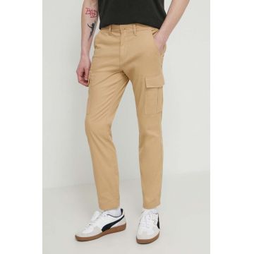 Tommy Jeans pantaloni bărbați, culoarea bej, mulată DM0DM18940