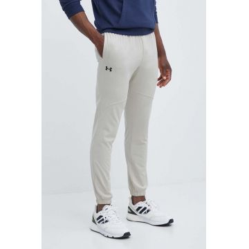 Under Armour pantaloni de trening culoarea bej, neted