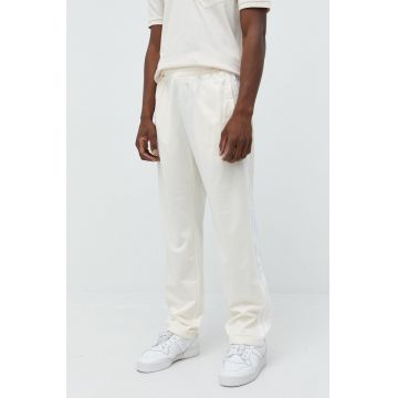 adidas Originals pantaloni de trening barbati, culoarea bej, cu imprimeu