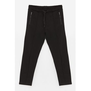 Pantaloni cu buzunare oblice
