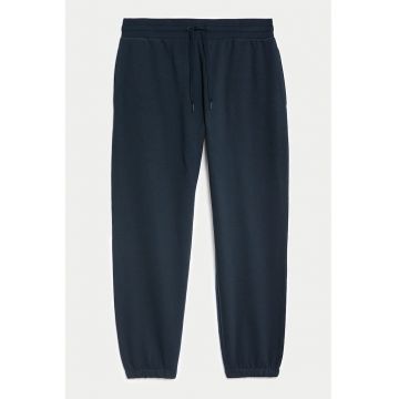 Pantaloni de trening cu croiala conica si buzunare oblice - Bleumarin