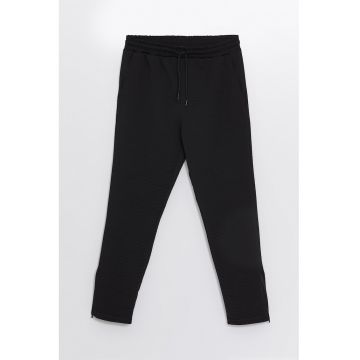 Pantaloni slim fit cu terminatii cu fermoar