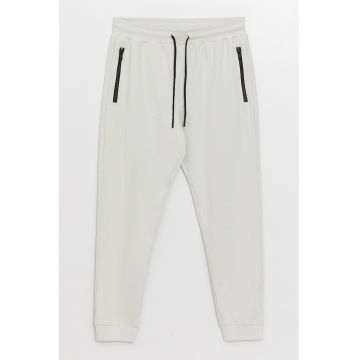 Pantaloni de trening cu buzunare cu fermoar