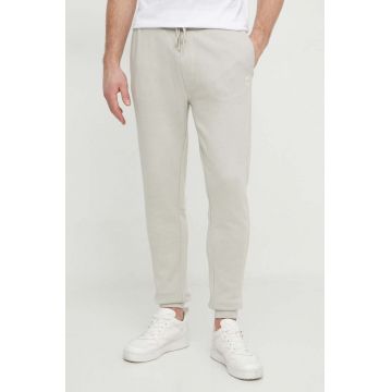 BOSS Orange pantaloni de trening din bumbac culoarea bej, melanj