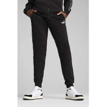 Pantaloni de trening cu croiala conica si buzunare laterale