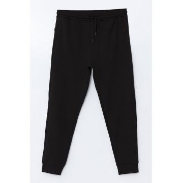 Pantaloni de trening din amestec de bumbac cu croiala conica