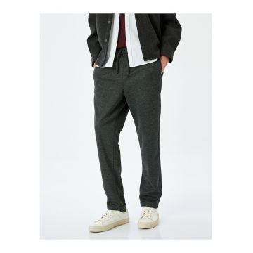 Pantaloni cu snur de ajustare si buzunare laterale