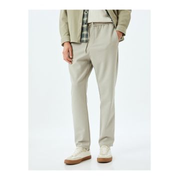 Pantaloni cu snur de ajustare si buzunare laterale