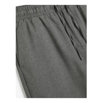 Pantaloni cu cnur si buzunare oblice