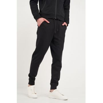 Pantaloni conici uni de trening