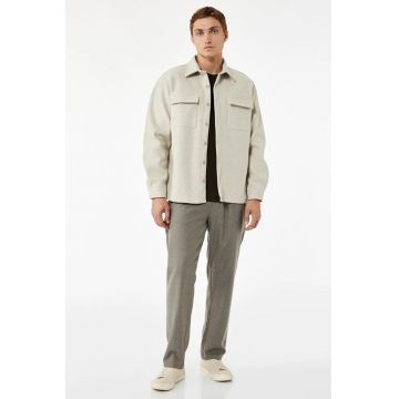 Pantaloni conici cu model uni