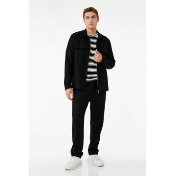Pantaloni conici cu model uni