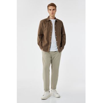 Pantaloni conici cu model uni