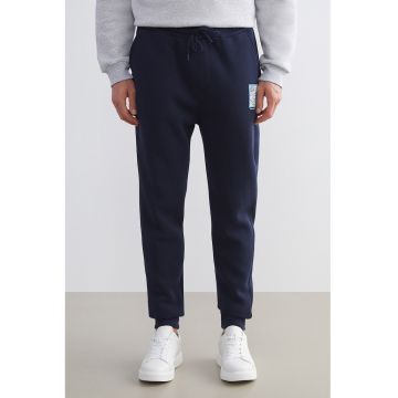 Pantaloni de trening cu croiala conica si doua buzunare oblice - Bleumarin