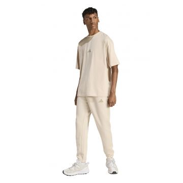Pantaloni de trening conici cu buzunare laterale - Crem