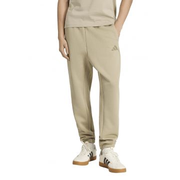Pantaloni de trening conici cu buzunare laterale - Bej