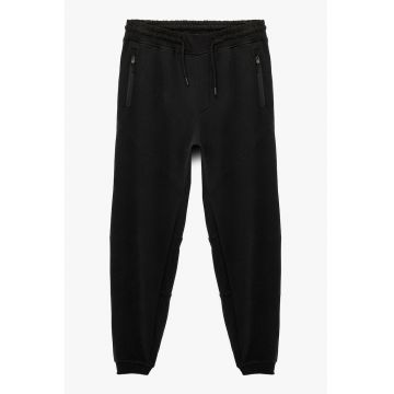 Pantaloni relaxed fit de trening cu buzunare - Negru