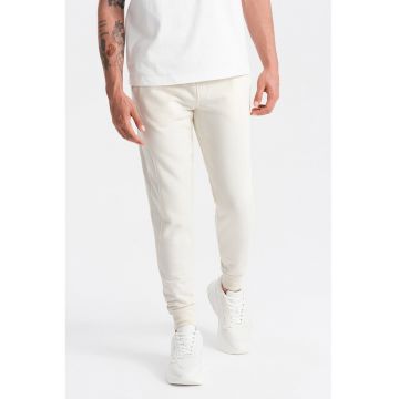 Pantaloni de trening din bumbac cu buzunare laterale - Crem