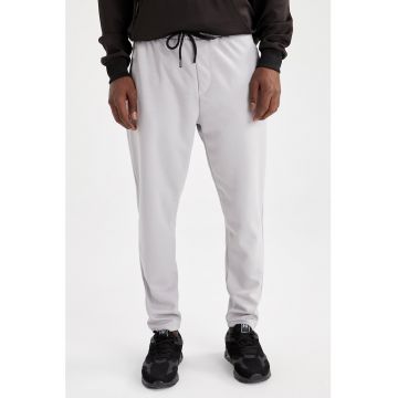 Pantaloni sport slim fit cu slituri cu fermoar la glezna