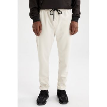 Pantaloni sport slim fit cu slituri cu fermoar la glezna